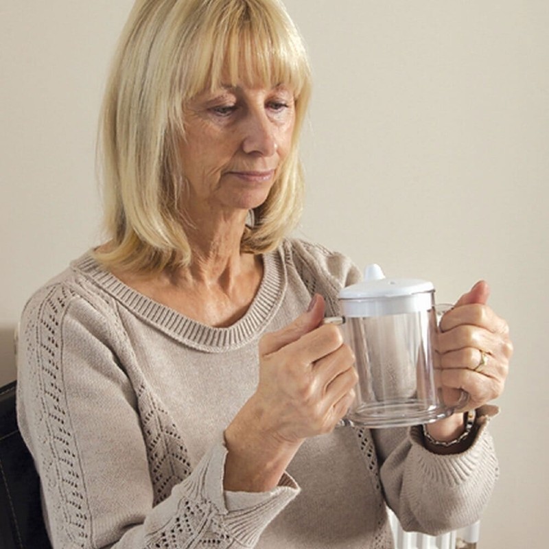 Woman Using the Wide Base Easy Grip Mug at Home